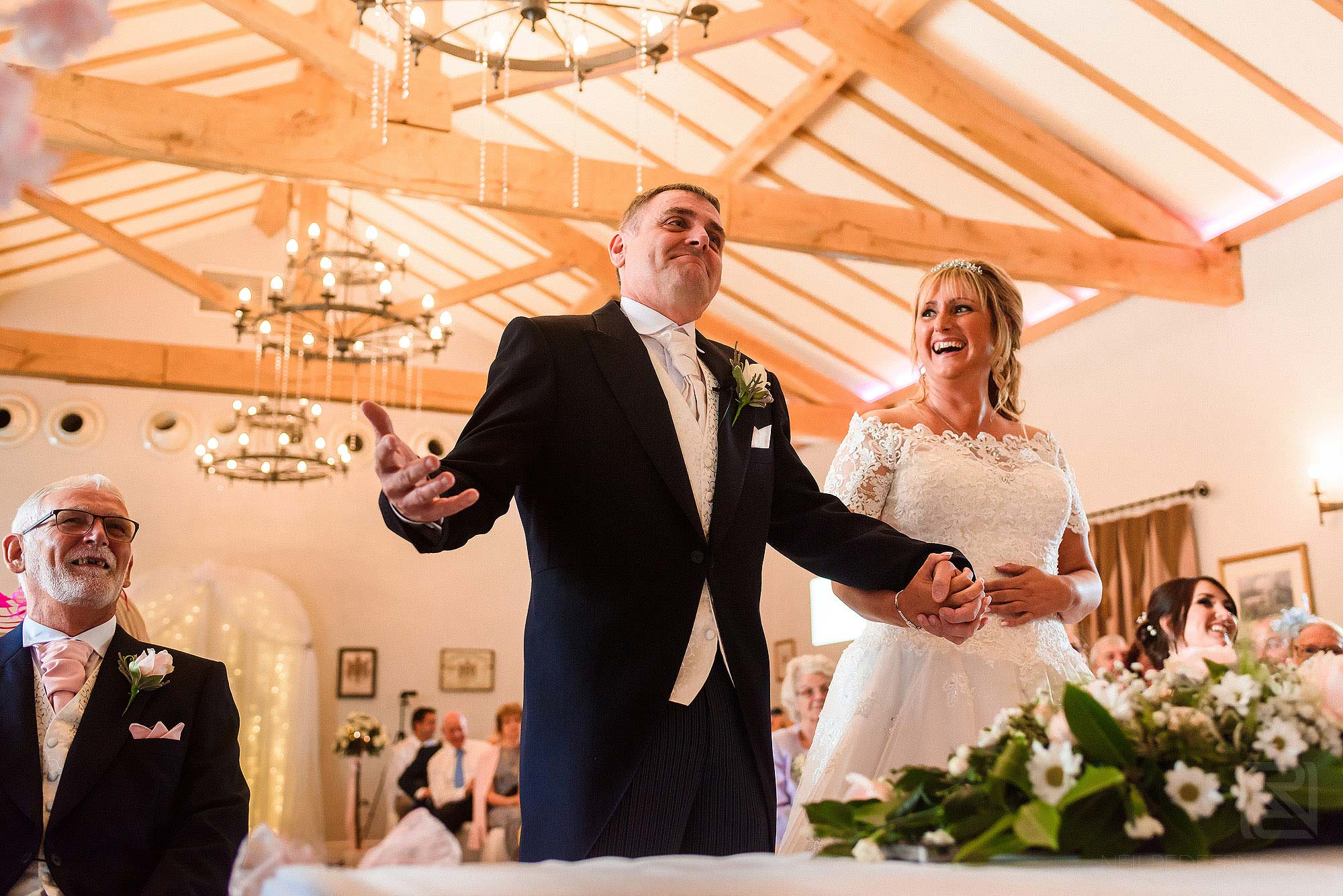 happy groom during wedding service