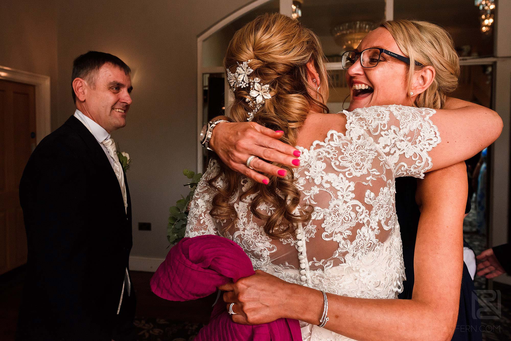 friend congratulating bride after wedding ceremony