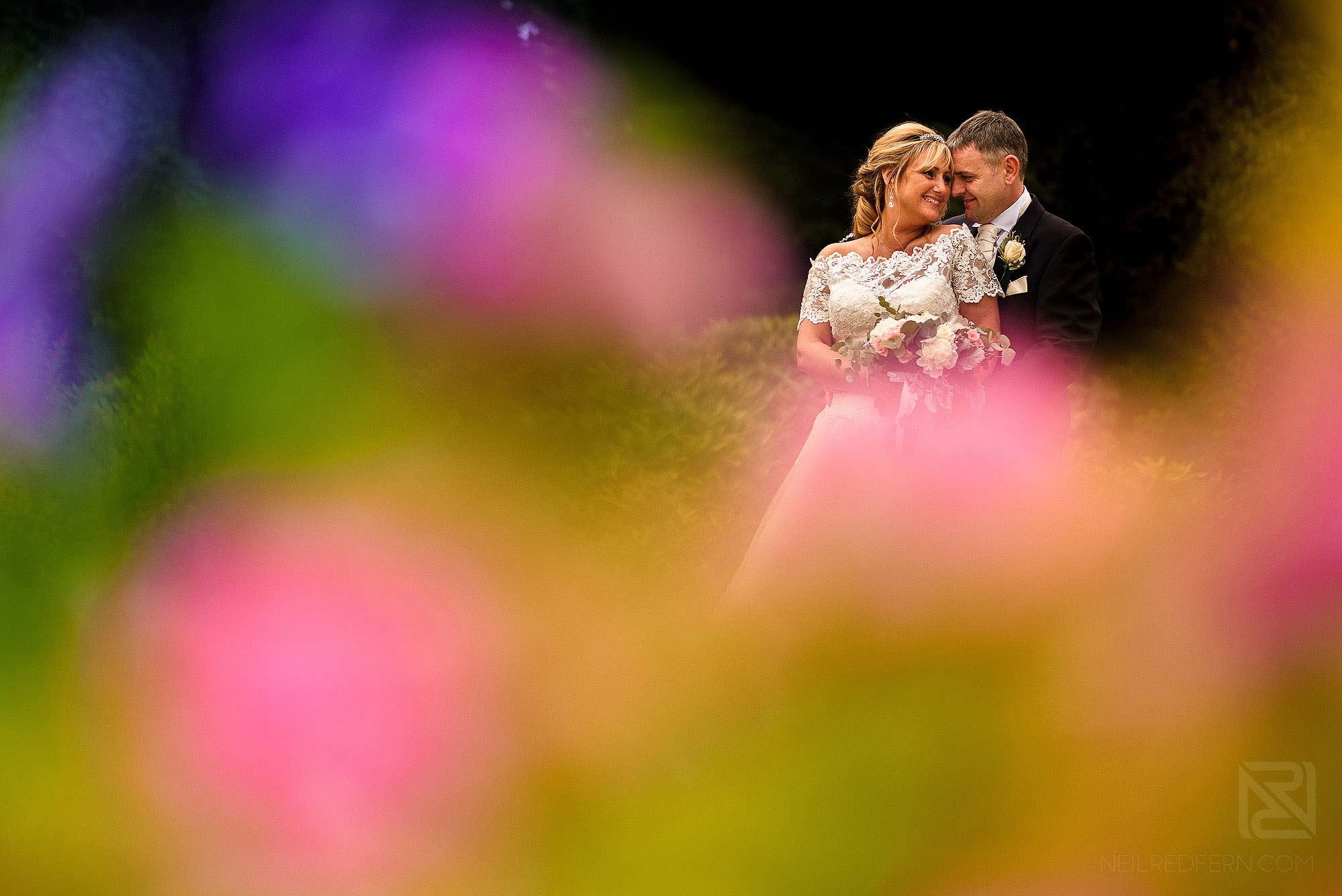 colourful portrait of bride and groom at The Villa Wrea Green in Lancashire