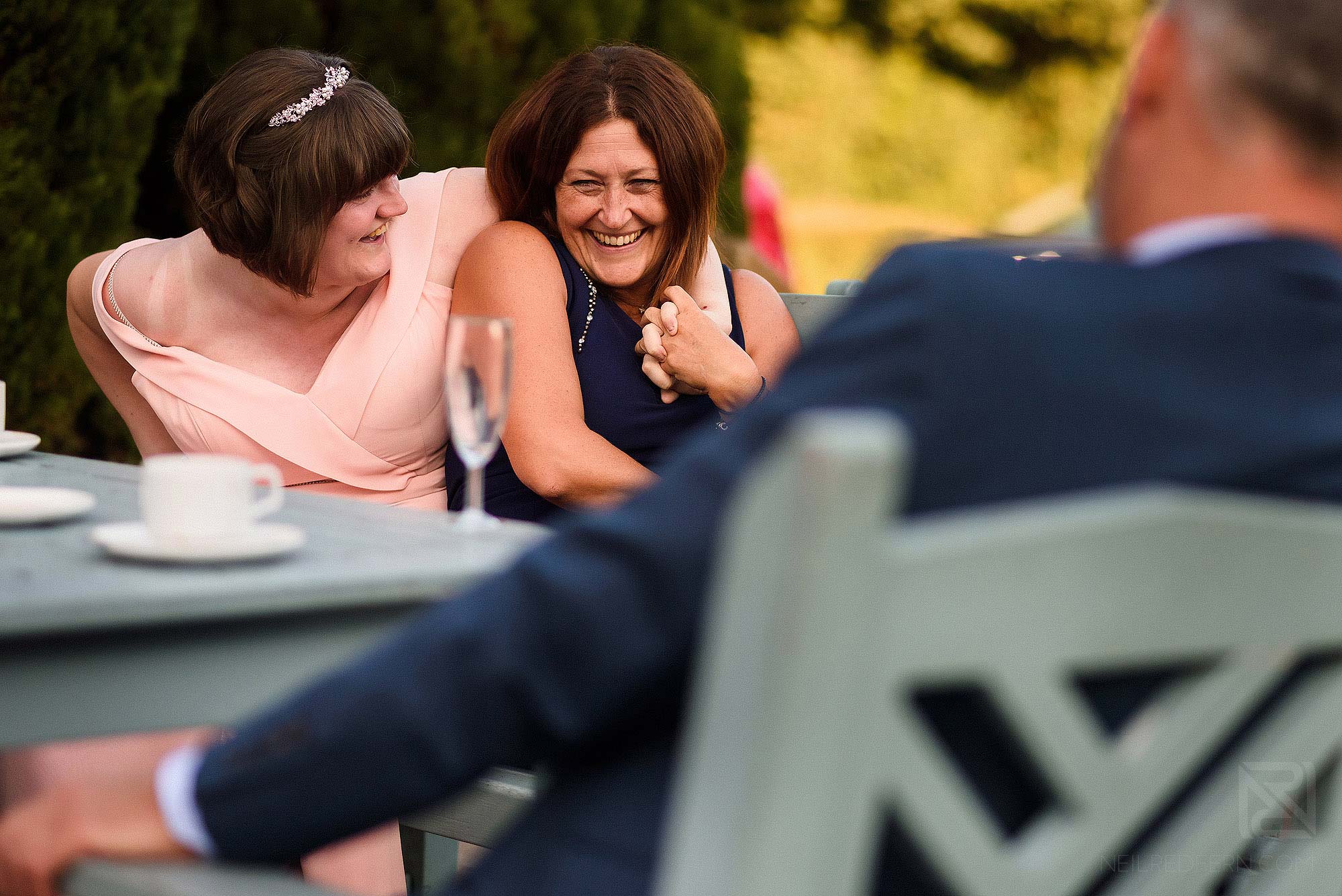wedding guests smiling and laughing