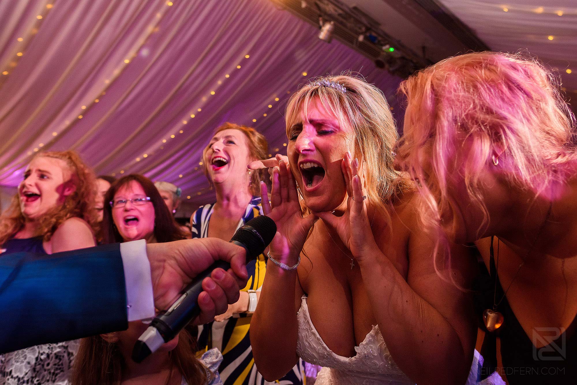 bride singing in to microphone