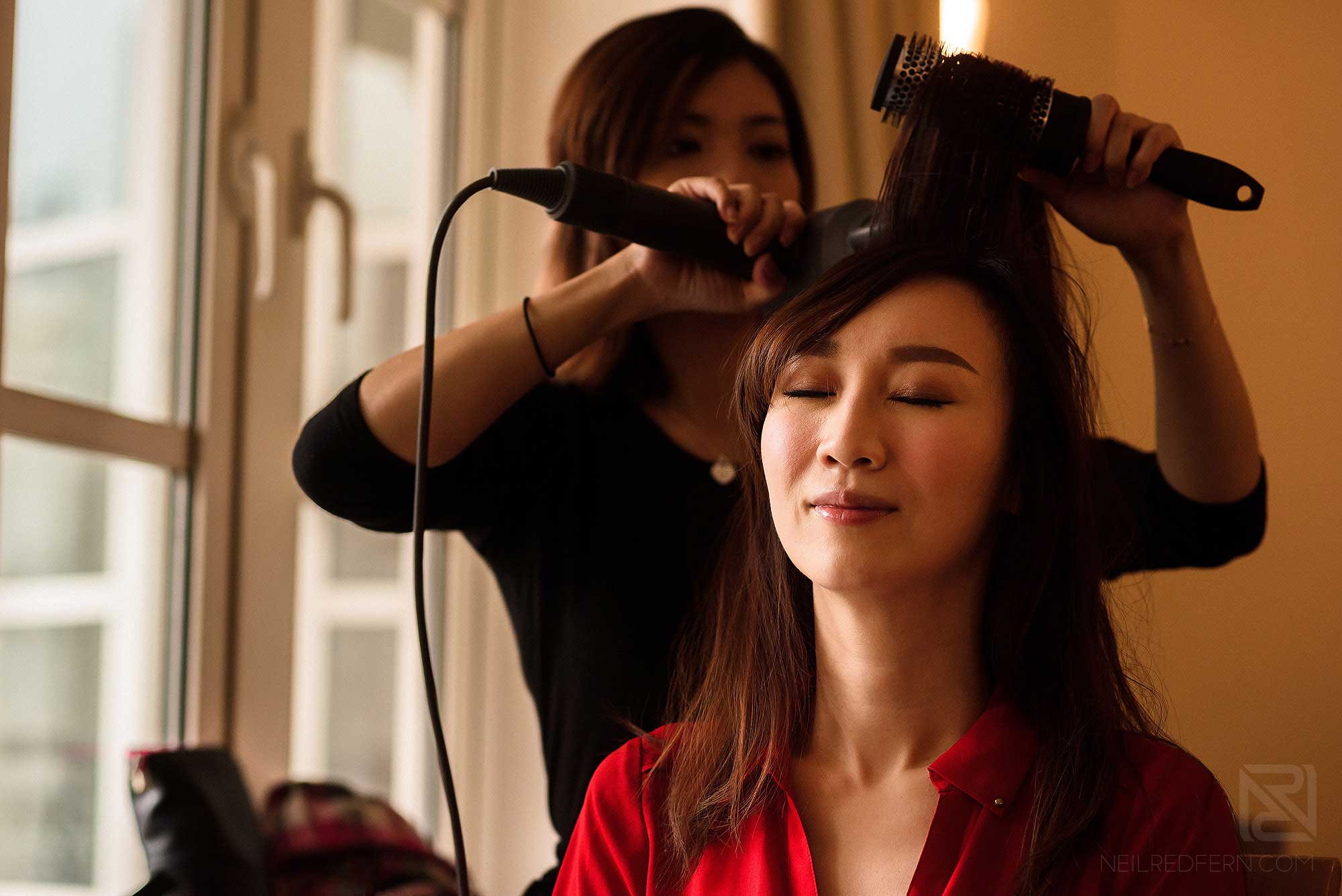 bride getting ready on morning of wedding