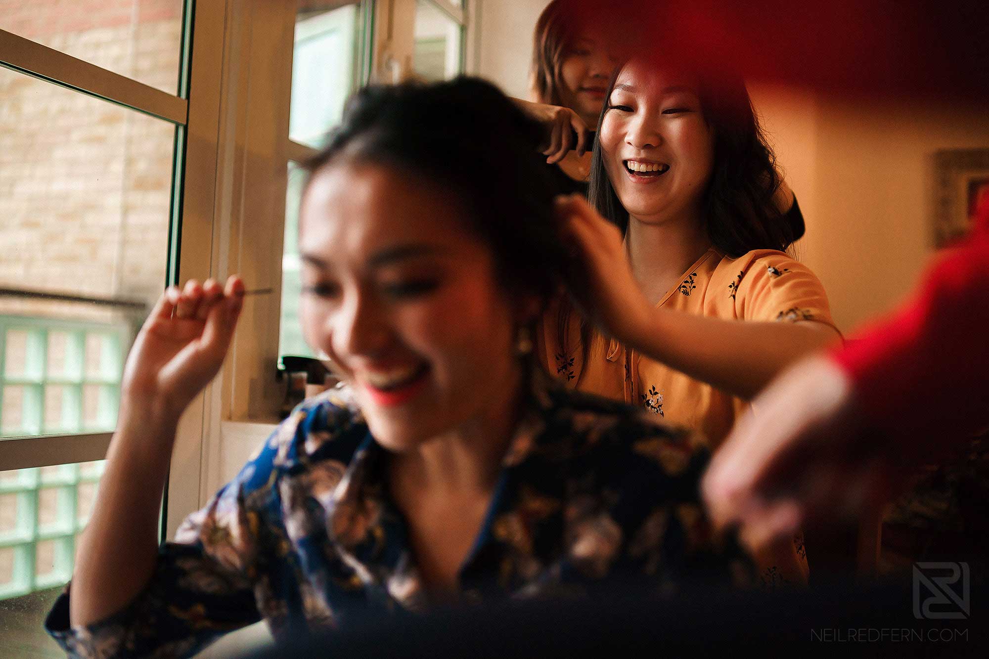 bridesmaids laughing on wedding day morning
