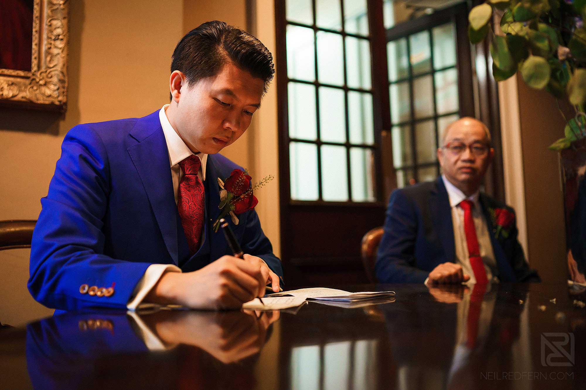 groom signing register