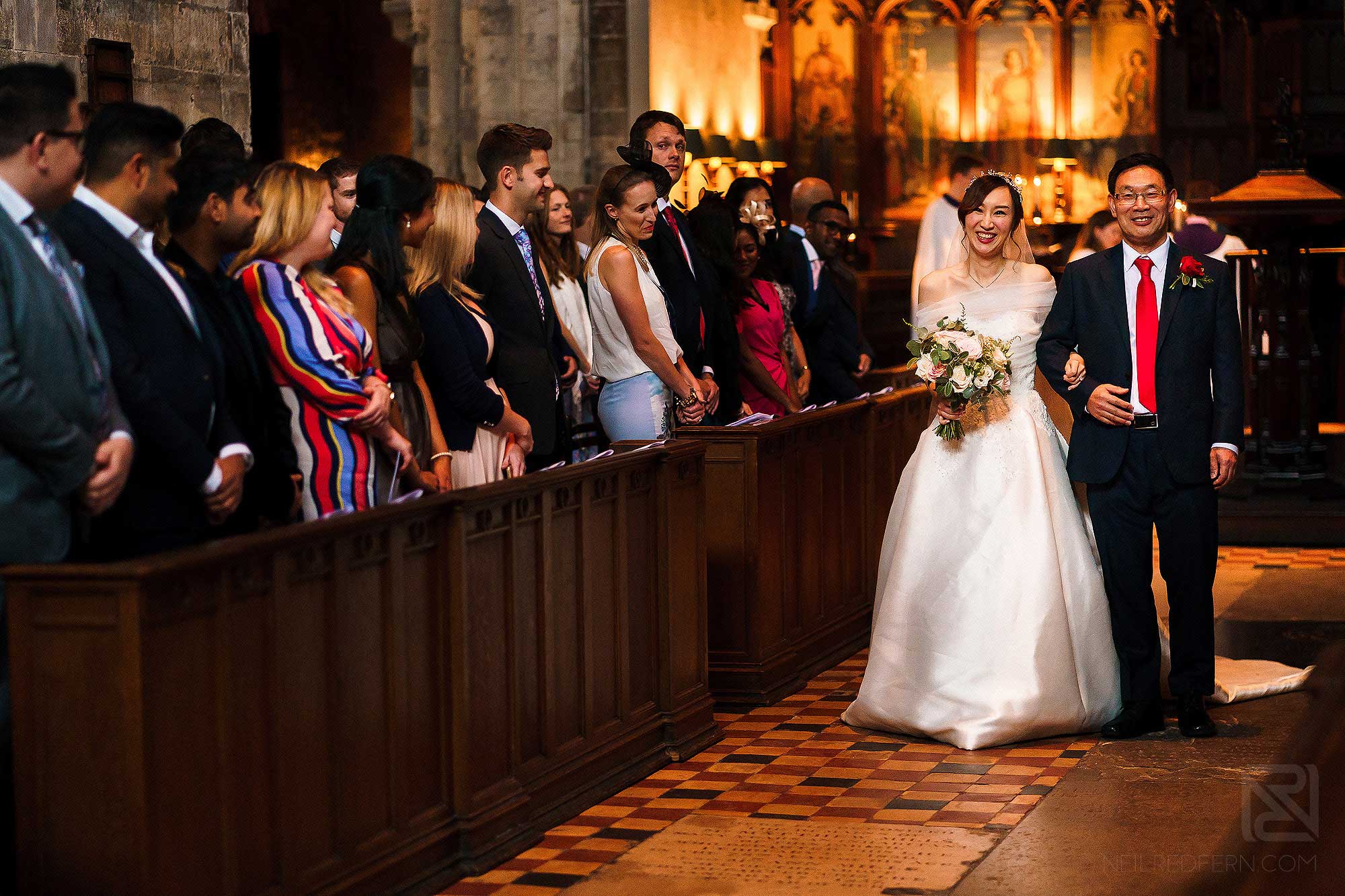 bride walking down the aisle with father