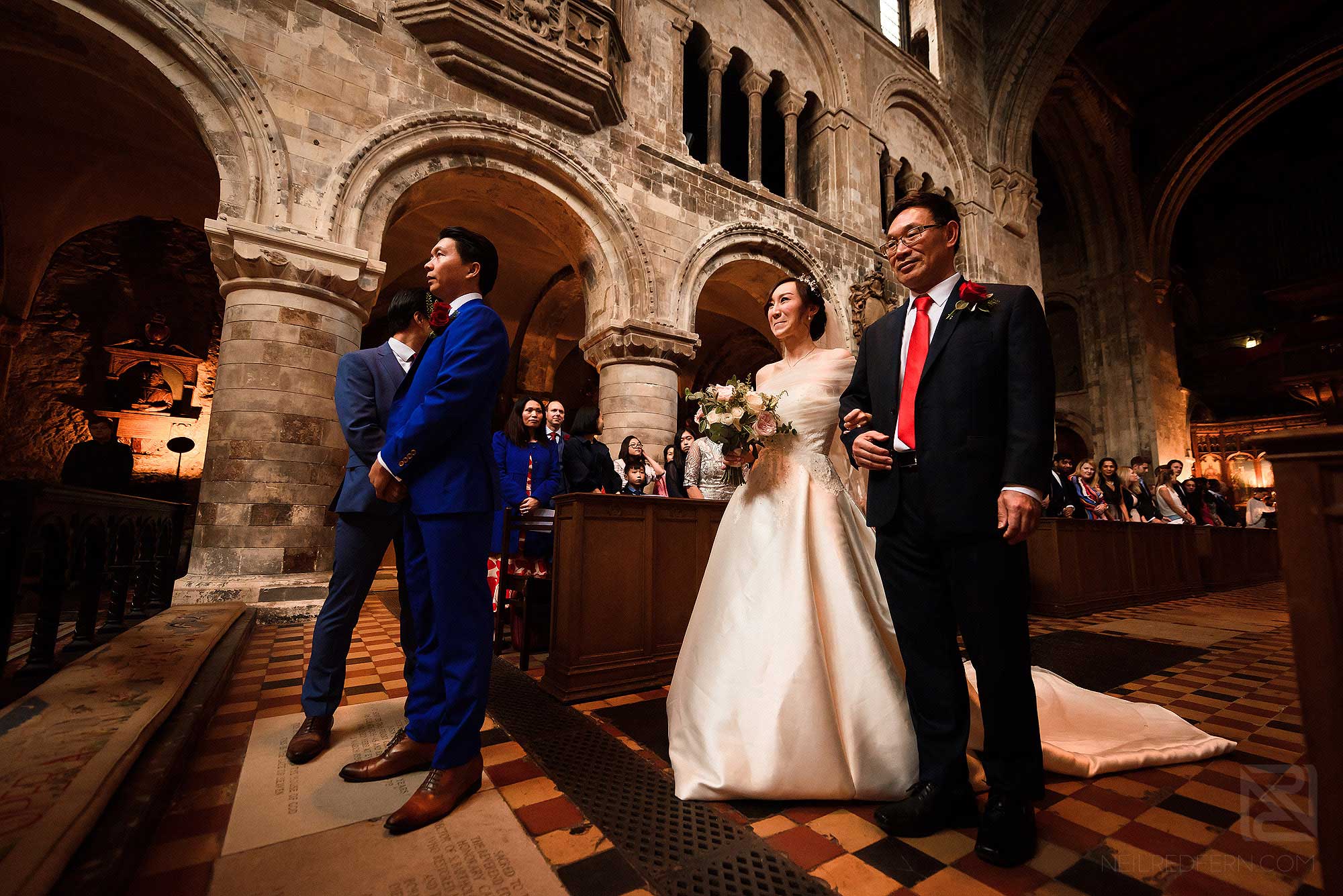 bride walking down the aisle at St Bartholomew the Great in London