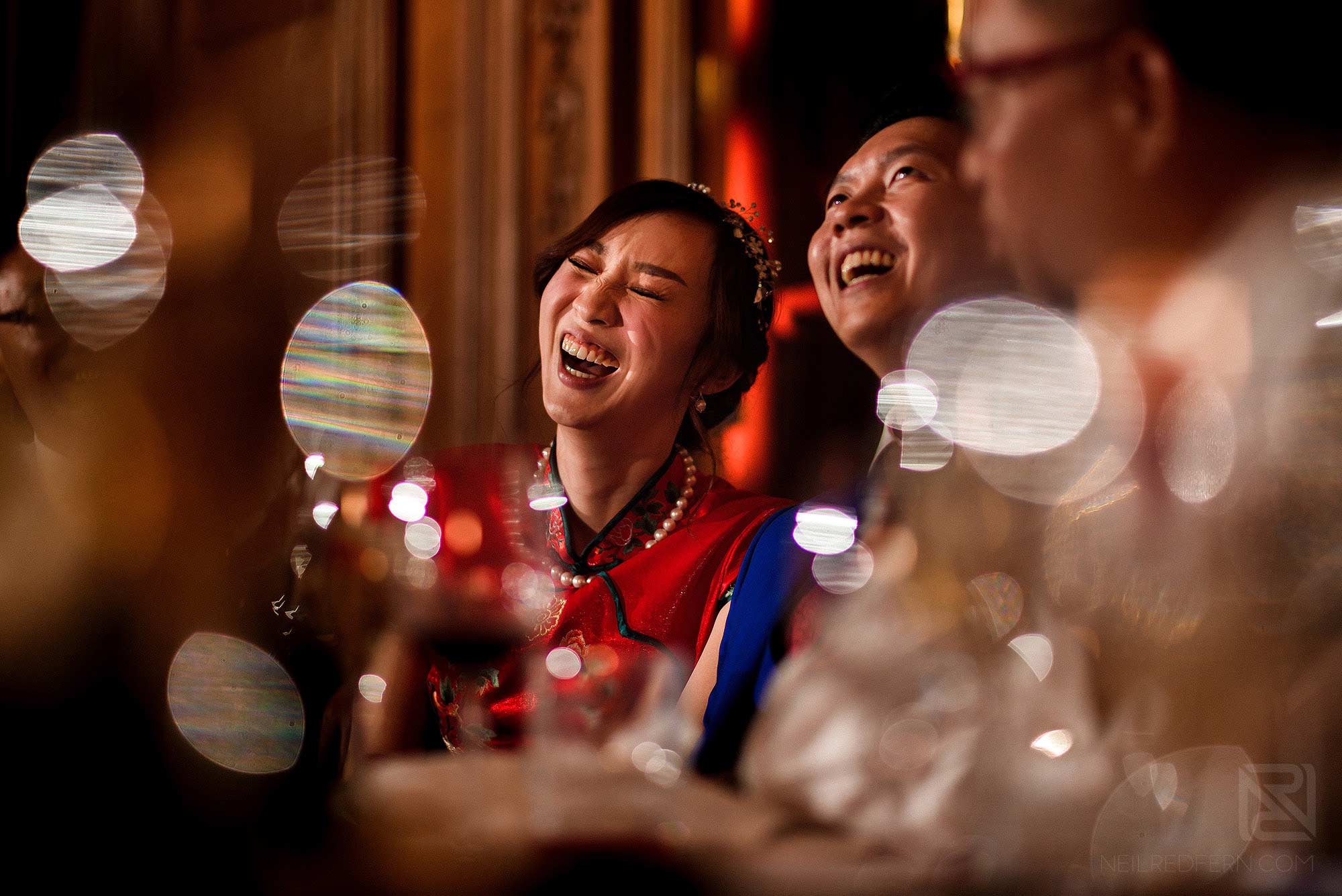 bride laughing during father's speech
