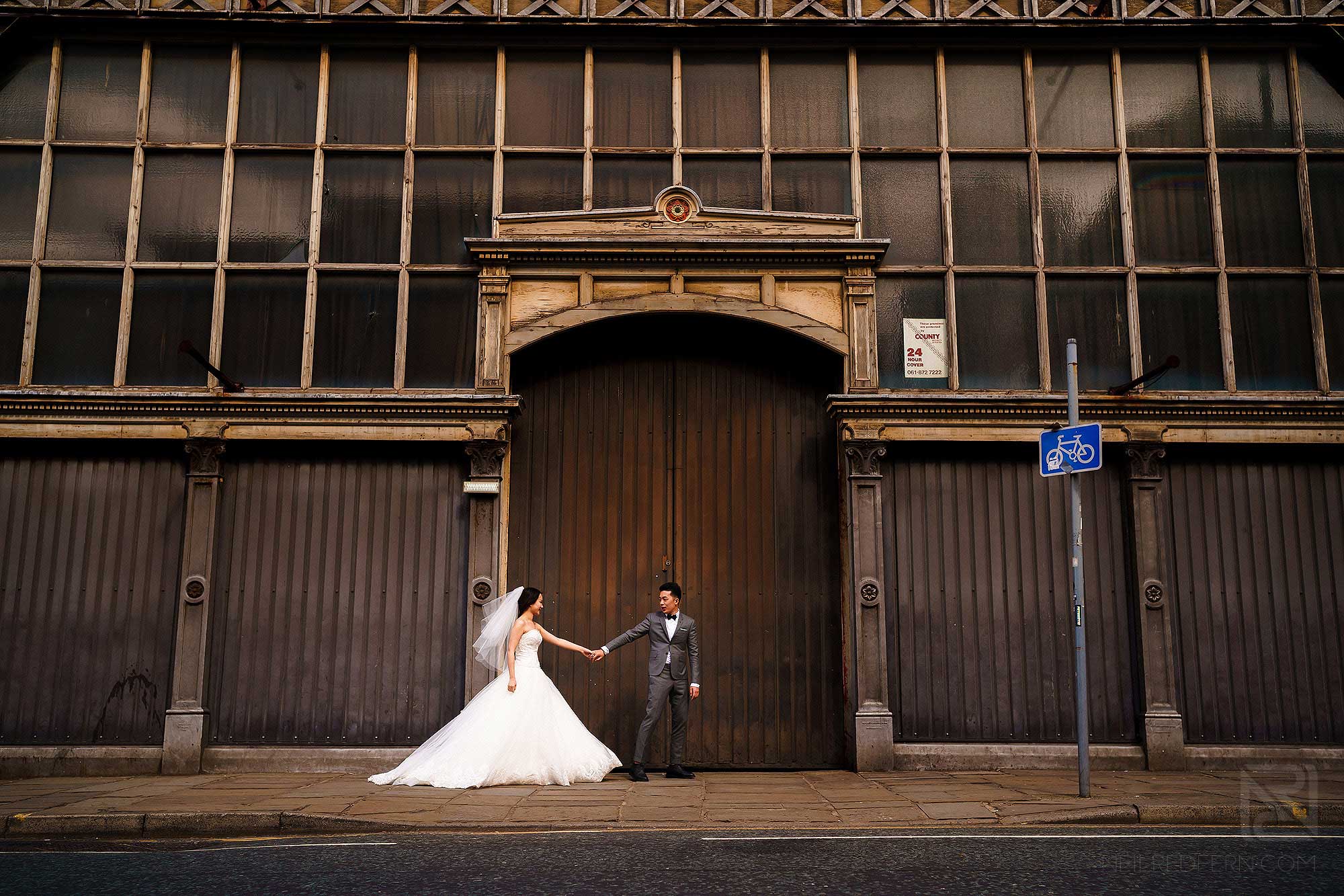 bride and groom outside Museum of Science and Industry in Manchester