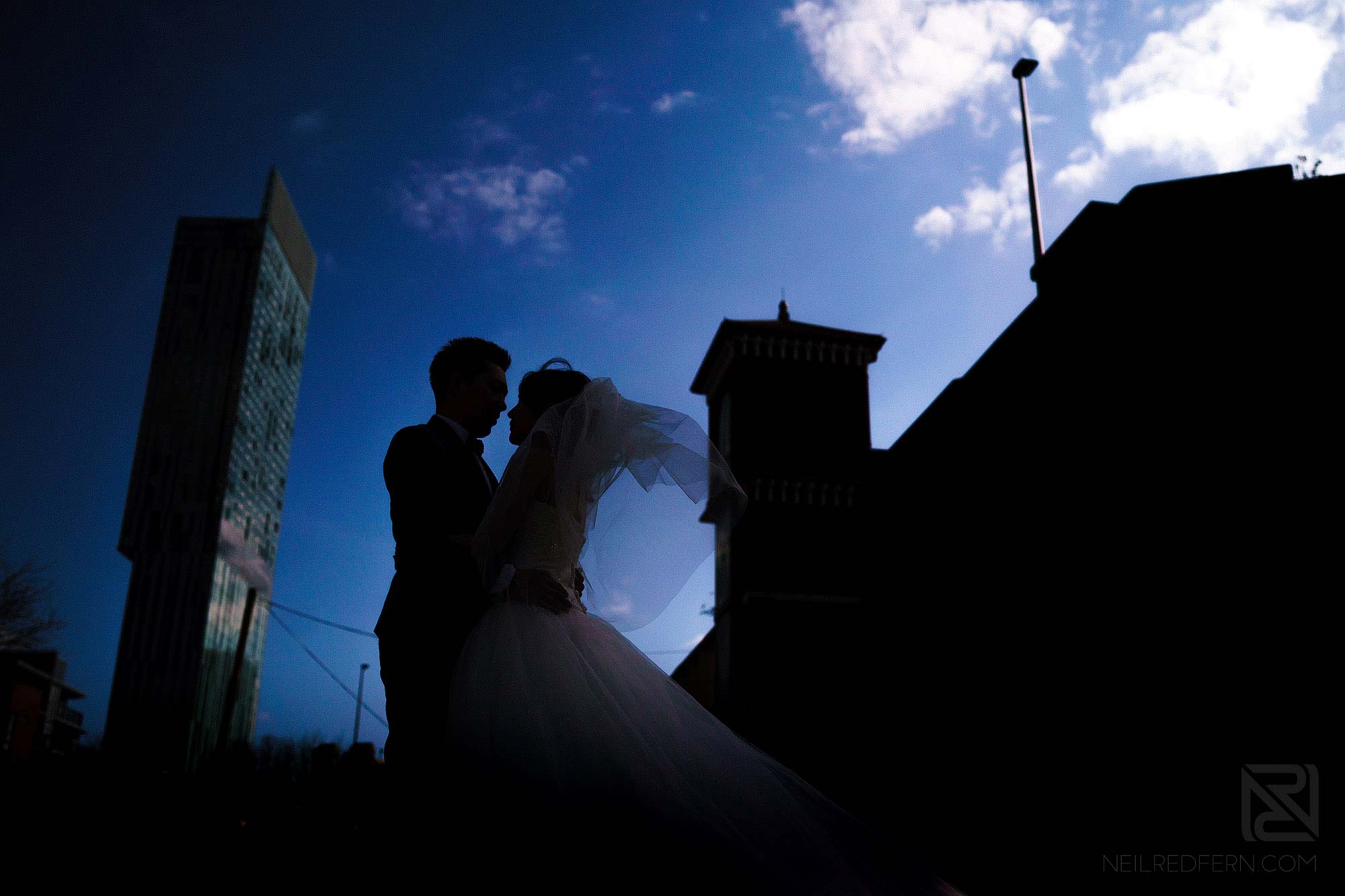 silhouette photograph of bride and groom on pre-wedding shoot