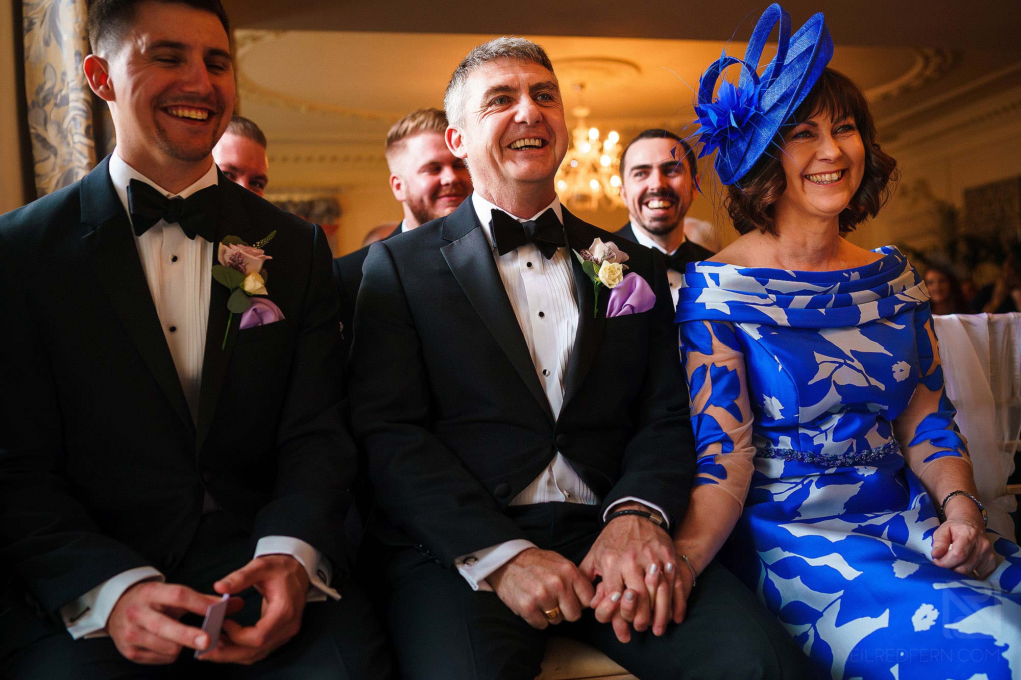 happy parents smiling during wedding ceremony