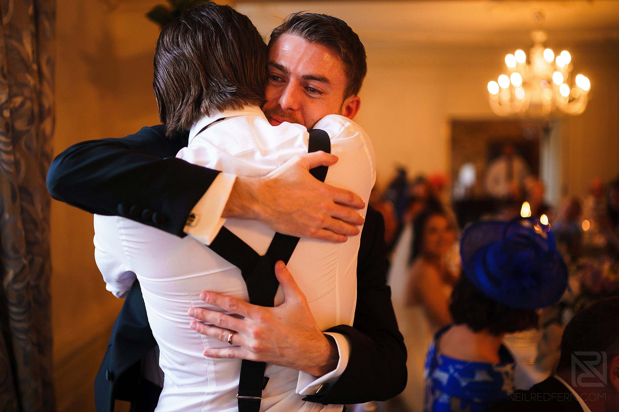 groom hugging Best Man after speeches