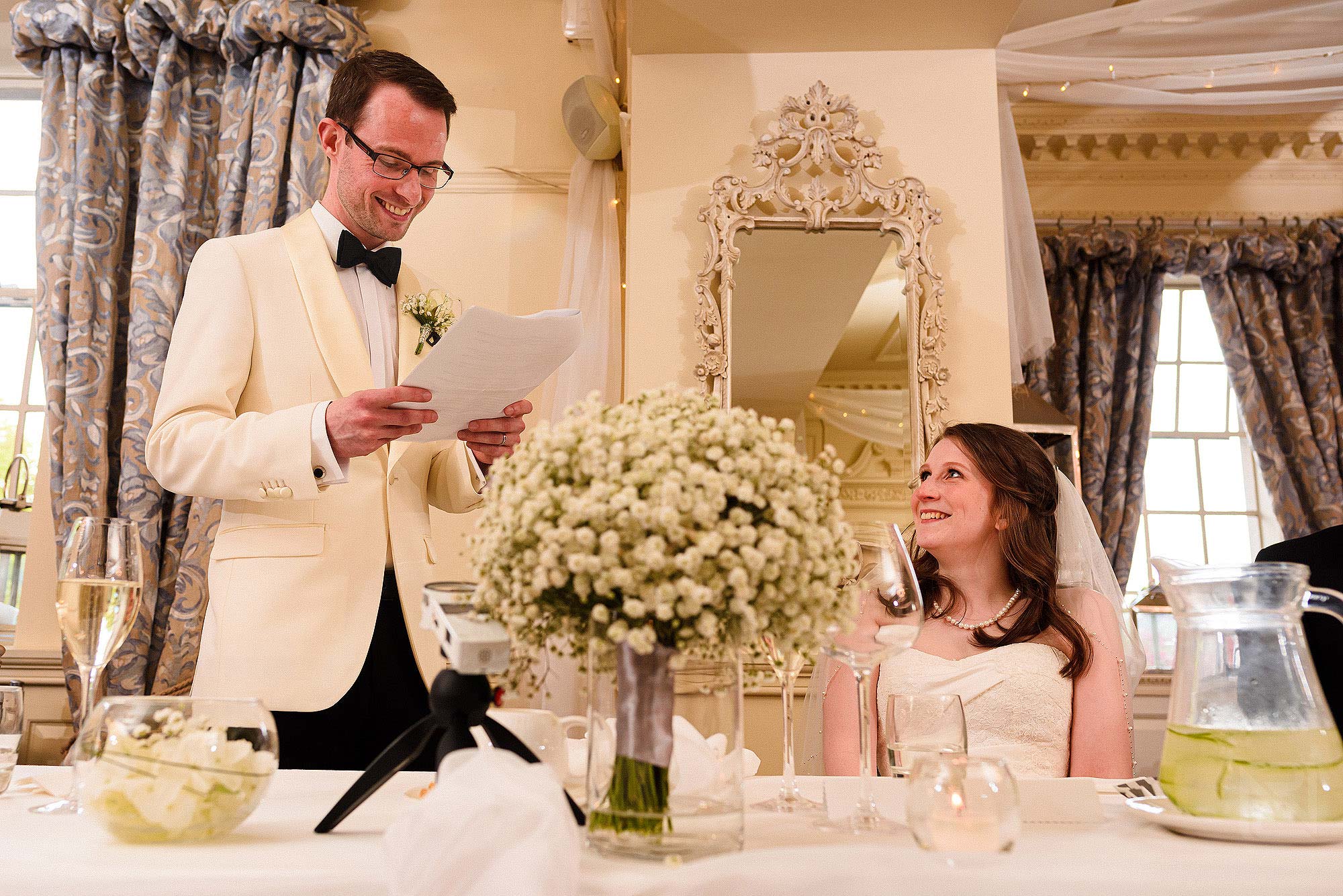 happy moment during wedding speeches at Eaves Hall