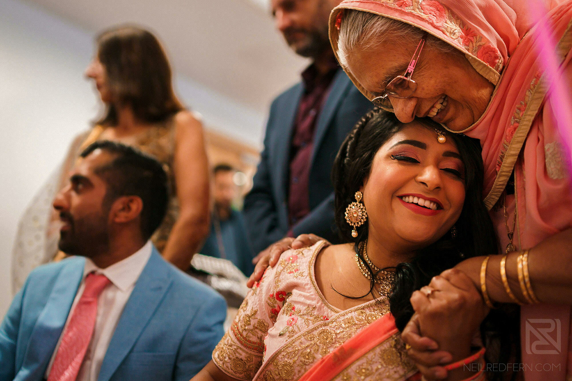 emotional hug for bride during Indian engagement party