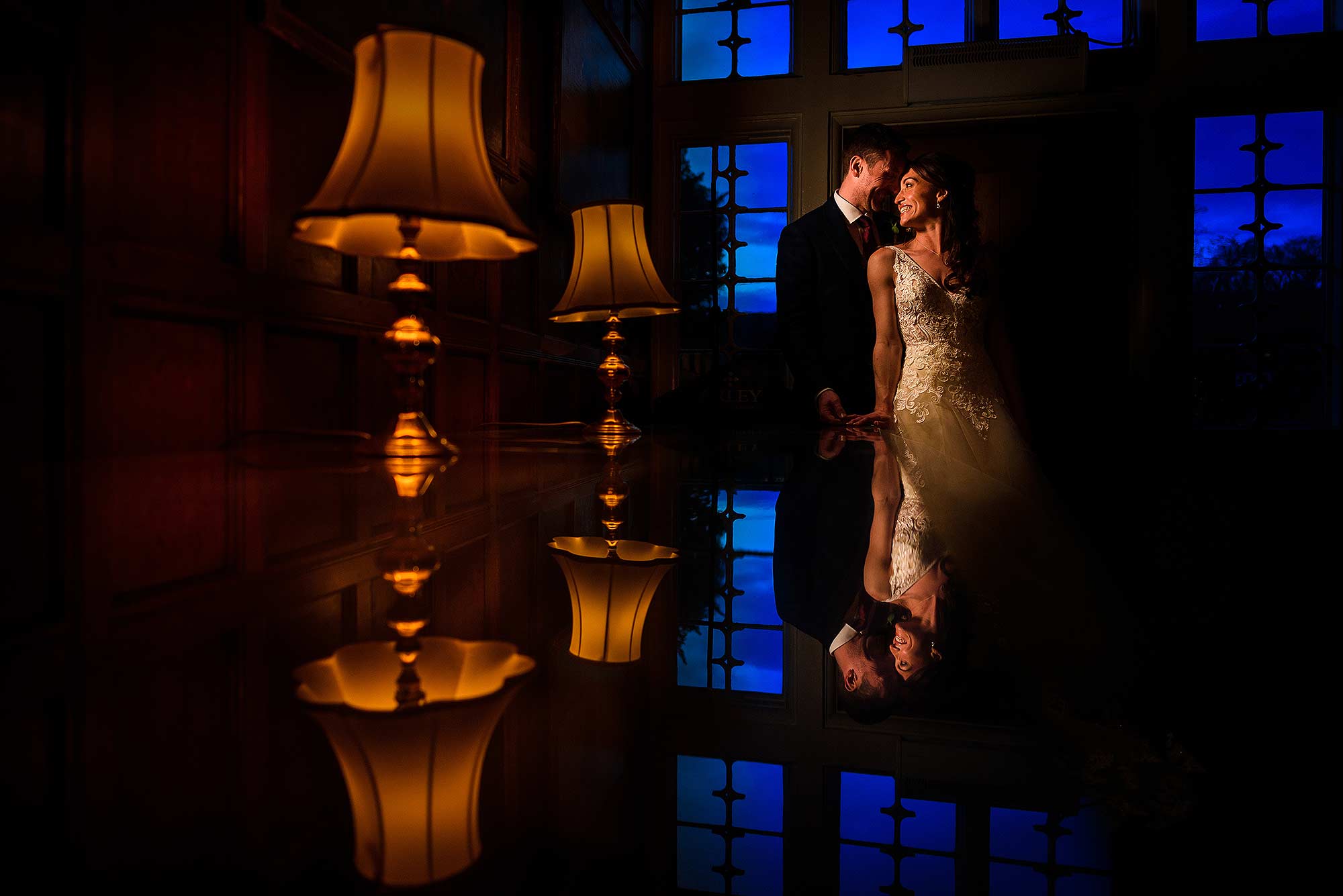 creative portrait of bride and groom inside Arley Hall