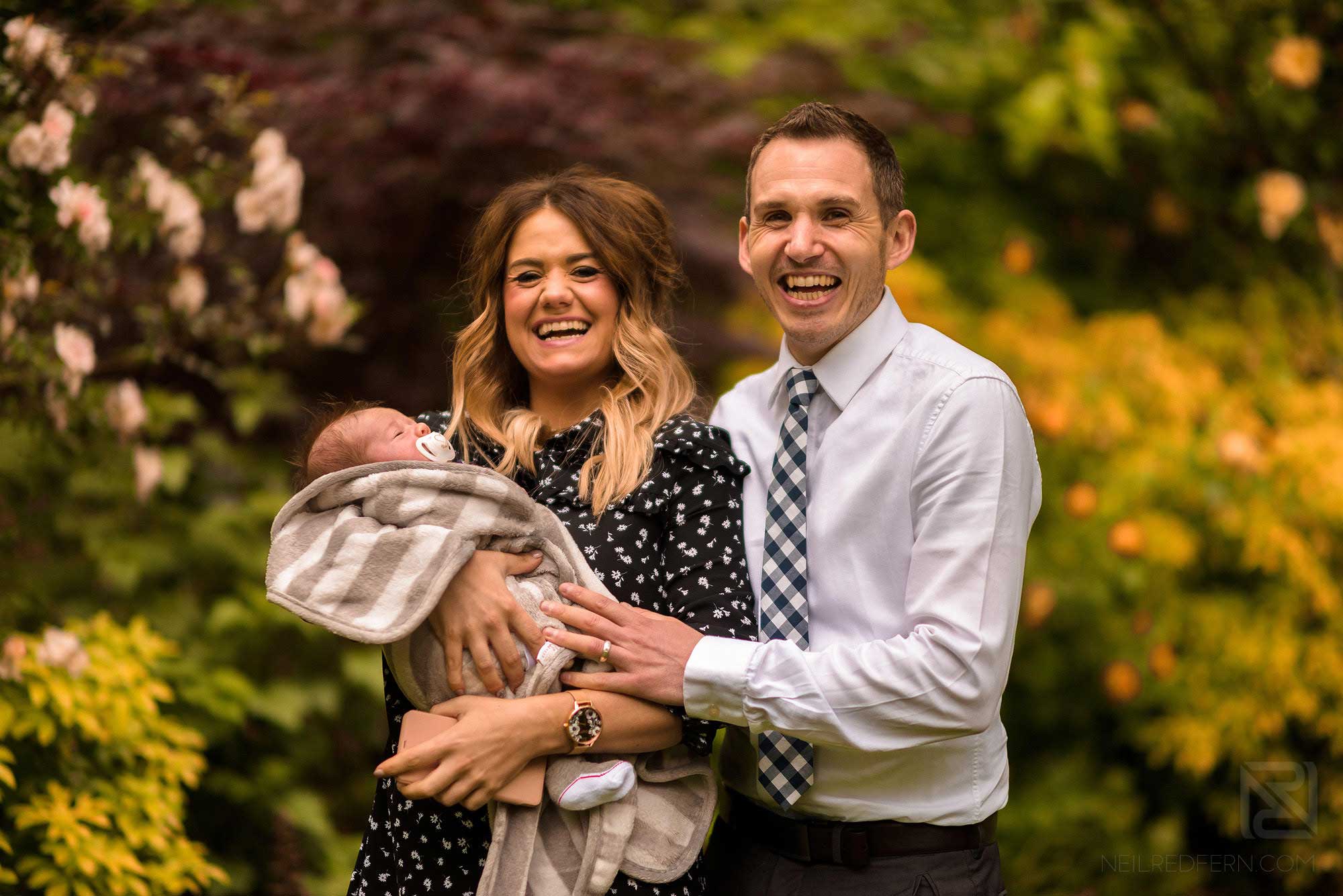 Family and couple portrait shoots 6 mum and dad laughing with baby