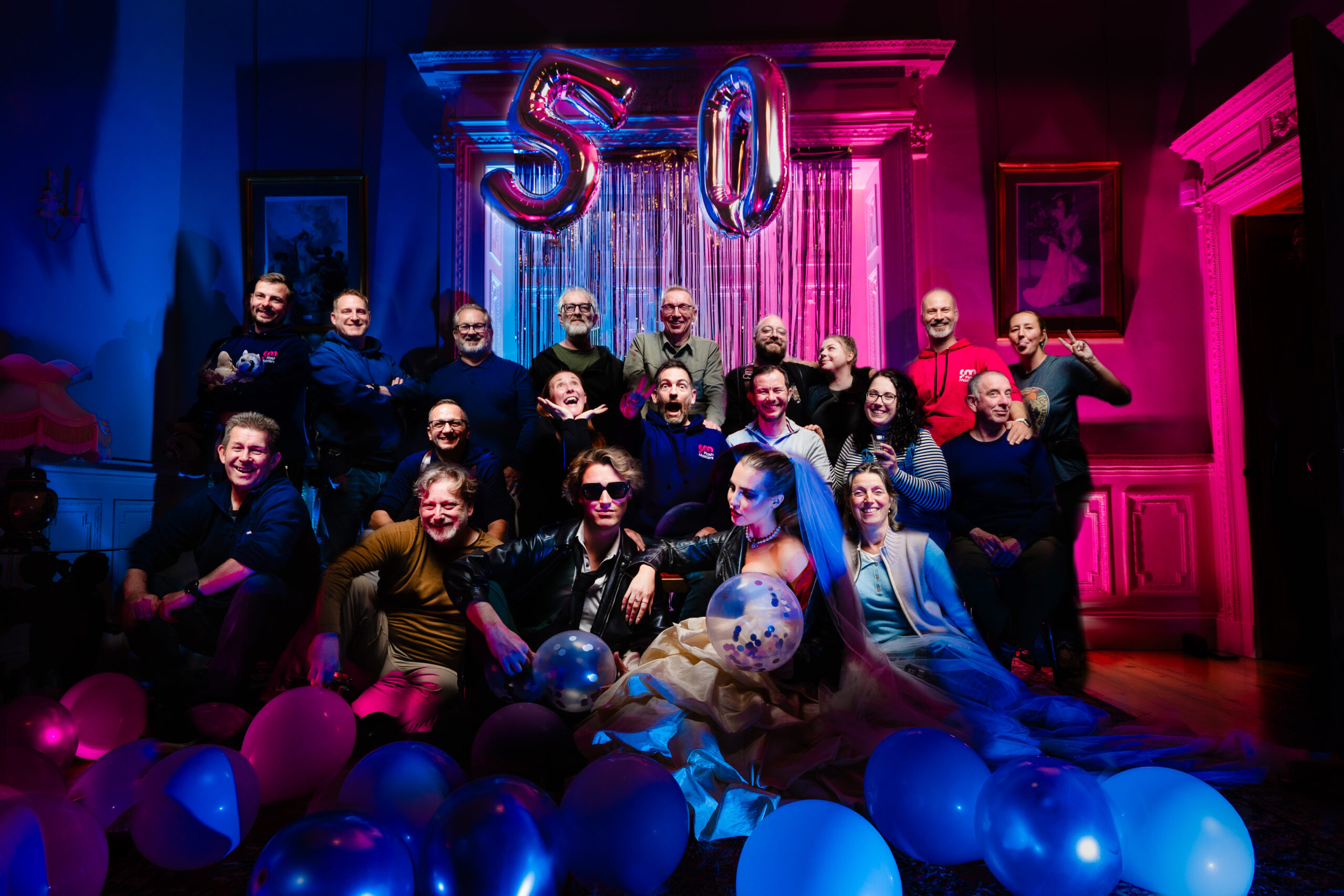 bride and groom with rainbow